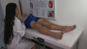 NURSE in routine care, attends to a patient with an erection